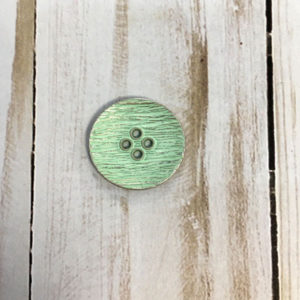 Botón con textura verde brillante